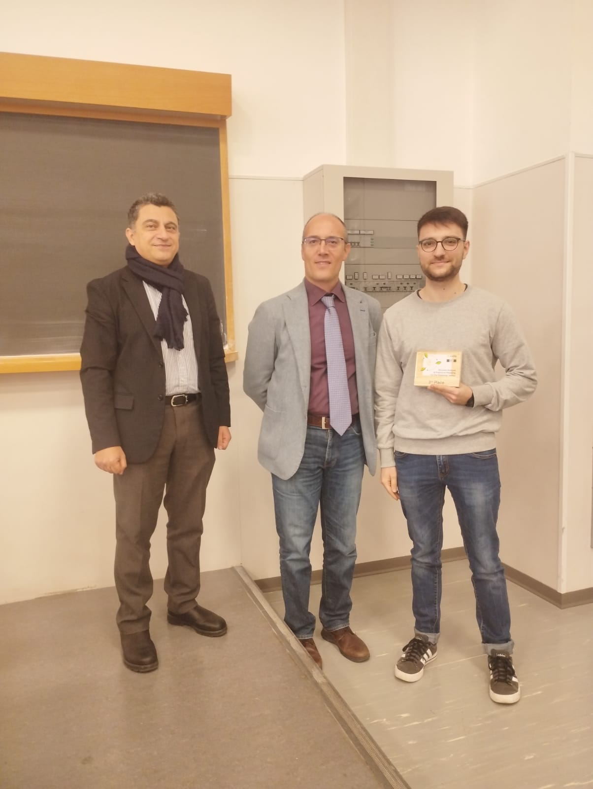 Pasquale receiving award for student challenge win