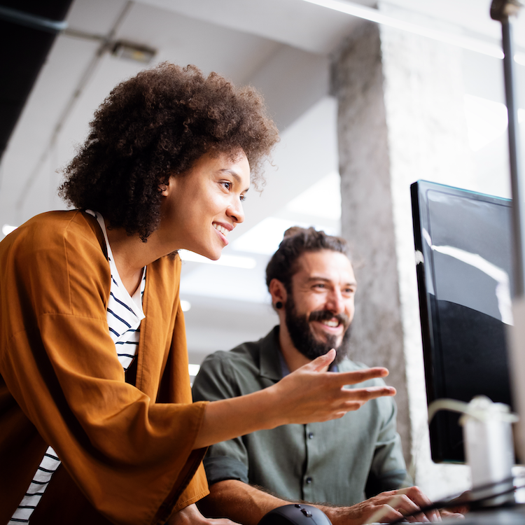 two workers at a computer